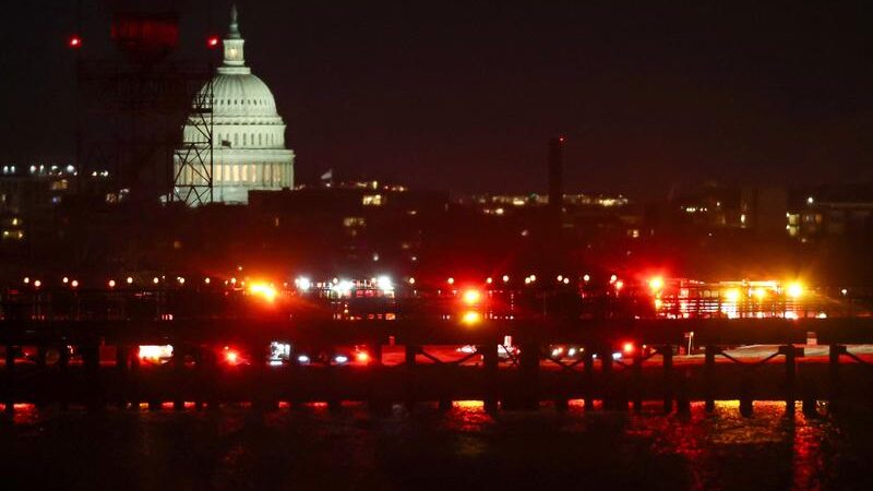 Washington plane crash: rescuers search for survivors after passenger plane collides with military helicopter