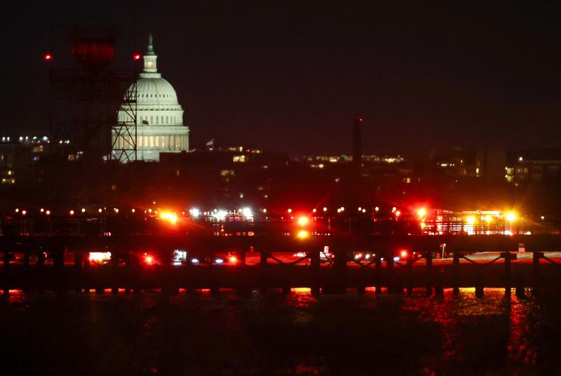 Washington plane crash: rescuers search for survivors after passenger plane collides with military helicopter